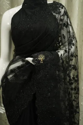 Designer black soft net saree with chikankari work highlighted by diamond work