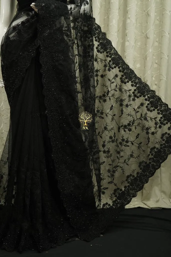 Designer black soft net saree with chikankari work highlighted by diamond work