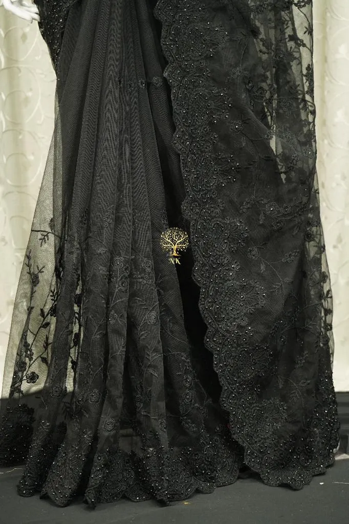 Designer black soft net saree with chikankari work highlighted by diamond work