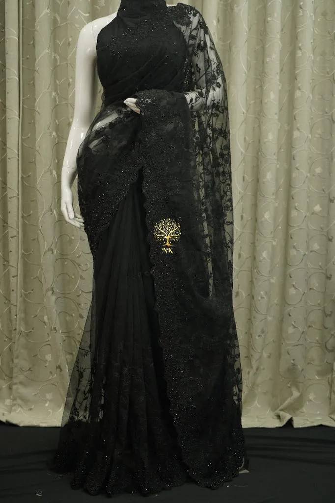 Designer black soft net saree with chikankari work highlighted by diamond work