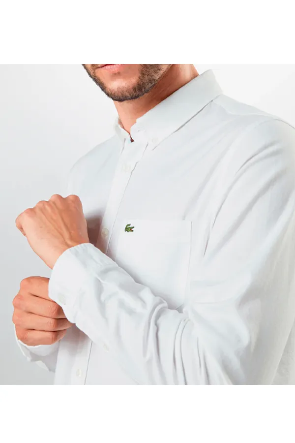 Lacoste white pocket shirt with logo.